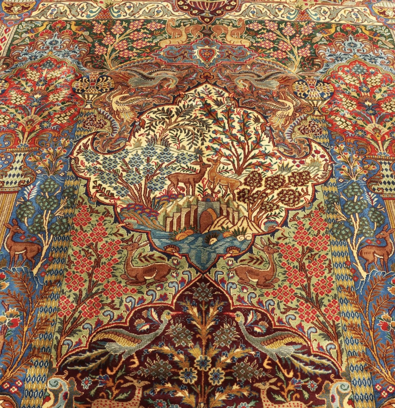 A cozy living room with a Persian rug adorning the hardwood floor. The rug's soft, plush fibers provide warmth and comfort underfoot, creating an inviting and relaxing space. A family gathers on the sofa, enjoying moments of togetherness while experiencing the tactile delight of the rug's texture.