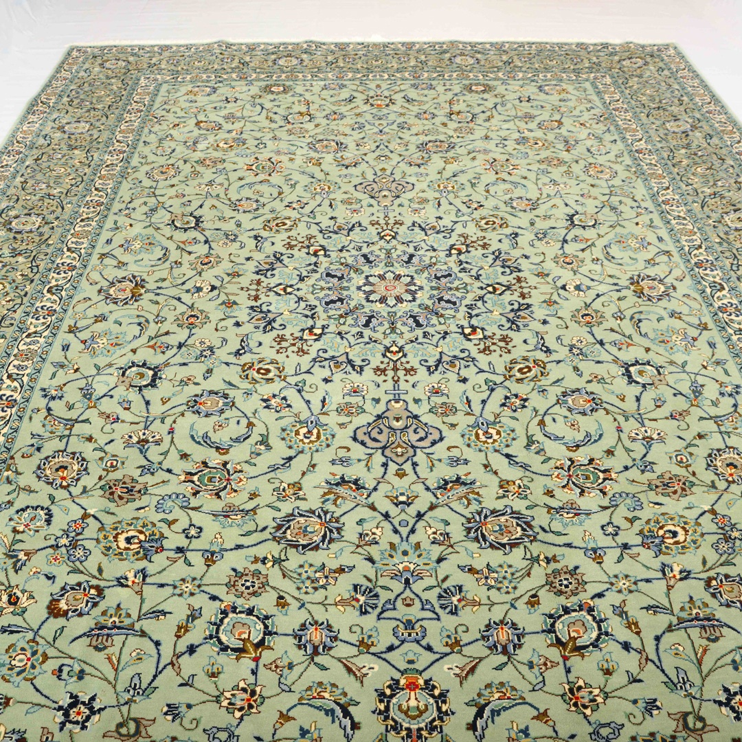 7 Compelling Reasons to Adorn Your Home with a Persian Rug 4 Close-up of a handmade traditional Persian rug with intricate floral designs and rich colors on display in a living room.