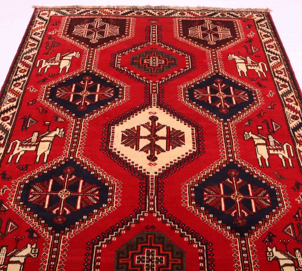 Picture of a Shiraz rug, displaying its bold and vibrant colors and intricate designs, adding energy and personality to a room's decor.
