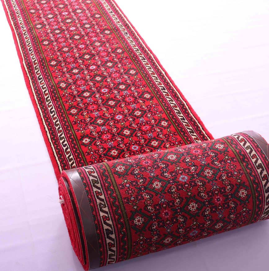 7 Compelling Reasons to Adorn Your Home with a Persian Rug 3 An image of a hallway with a Persian runner rug showcasing a beautiful and intricate traditional design, adding elegance and luxury to the space.